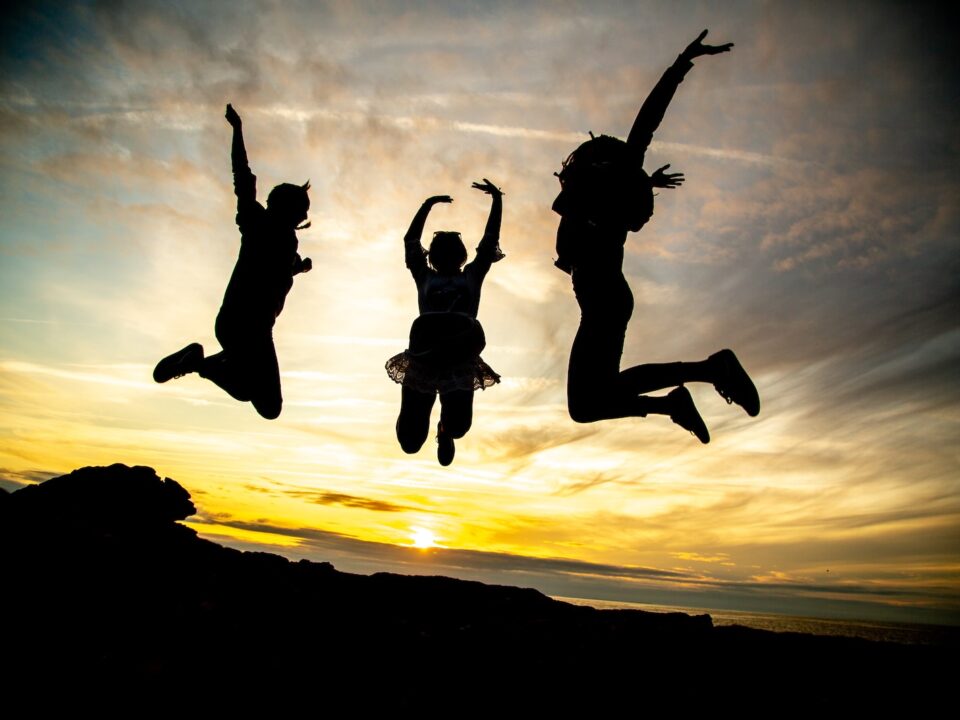 silhouette of jumping people