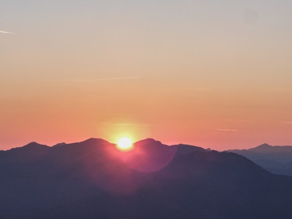 silhouette photo of mountain during dawn