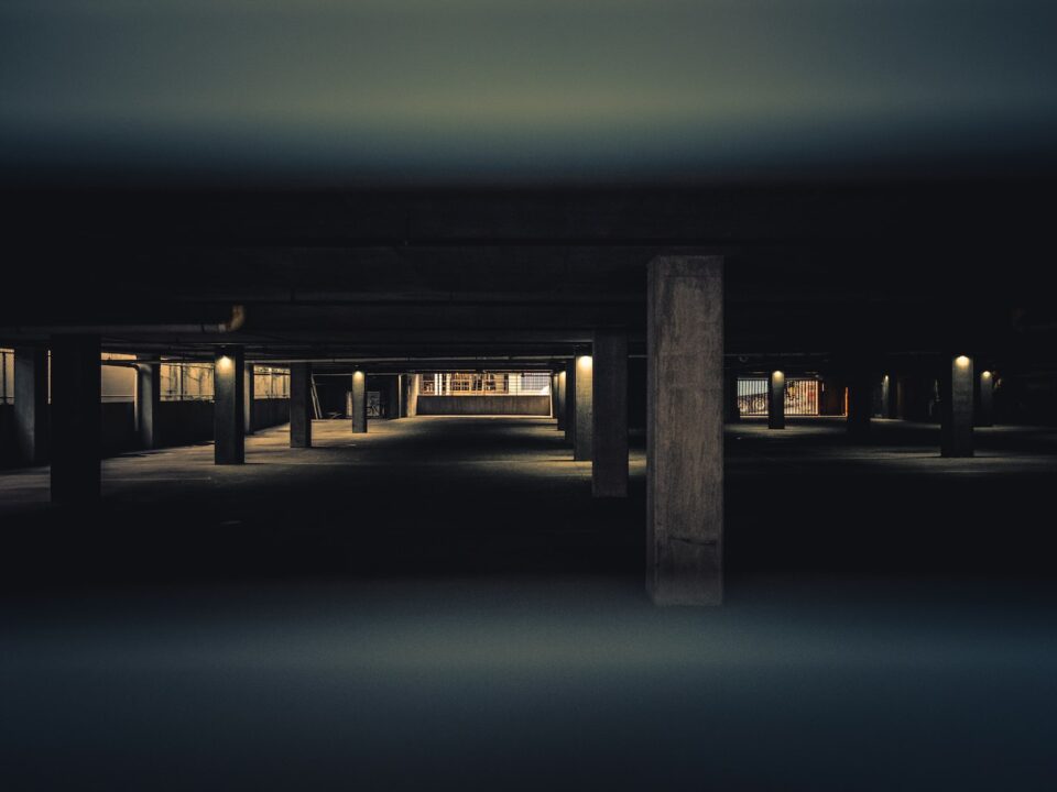 brown wooden dock with lighted lamp posts