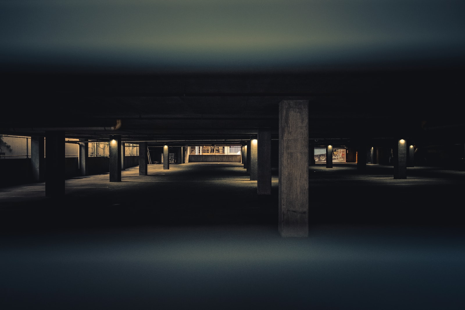 brown wooden dock with lighted lamp posts