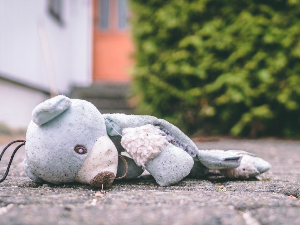 photo of bear plush toy on pavement
