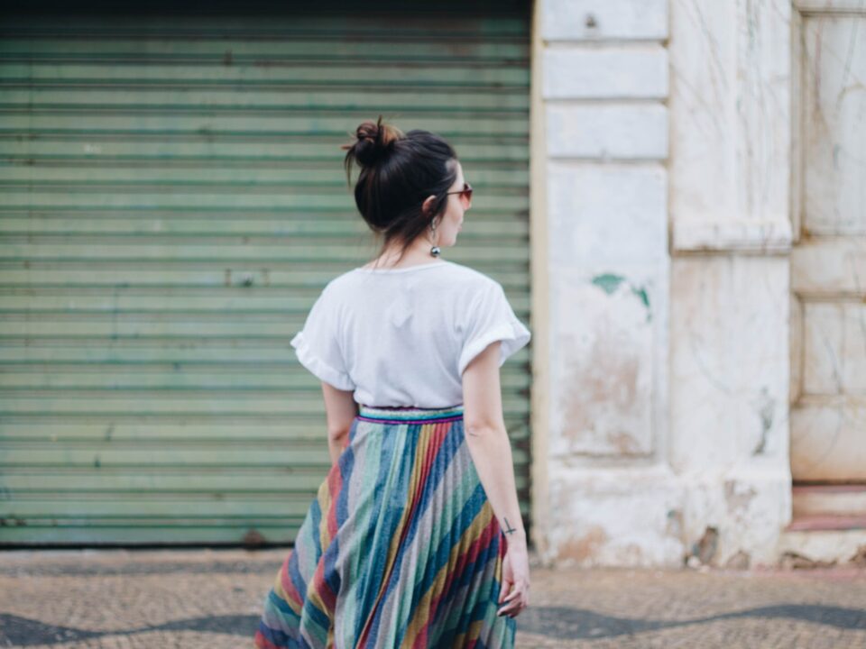 woman standing in front of green roller-shutter