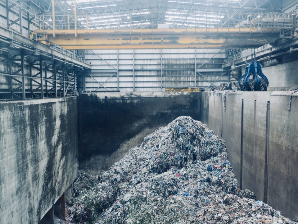 a large pile of garbage in a large building