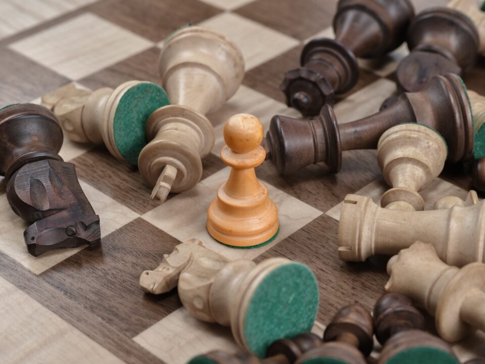 closeup photo of gray and brown chess board set