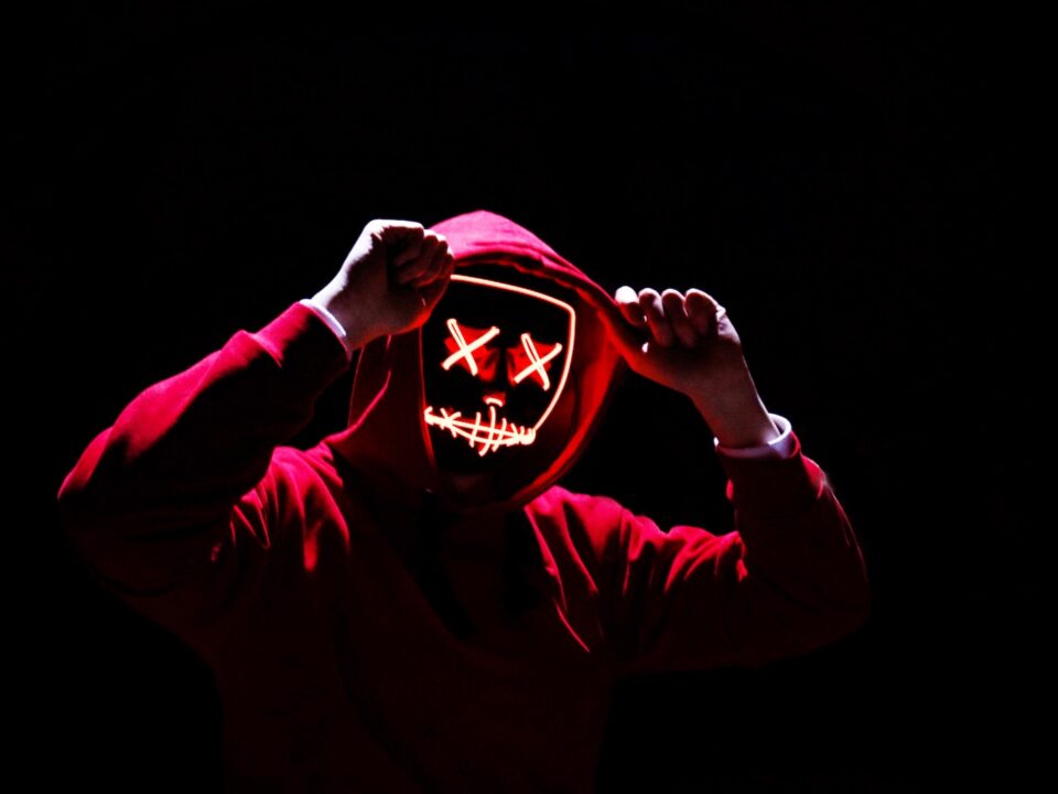 a person wearing a mask with a creepy face