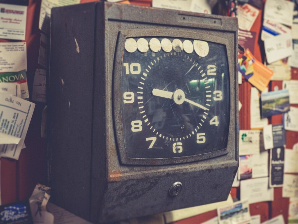black and brown analog desk clock