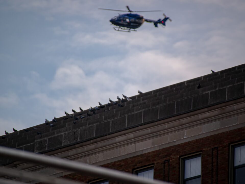 a helicopter flying over a building