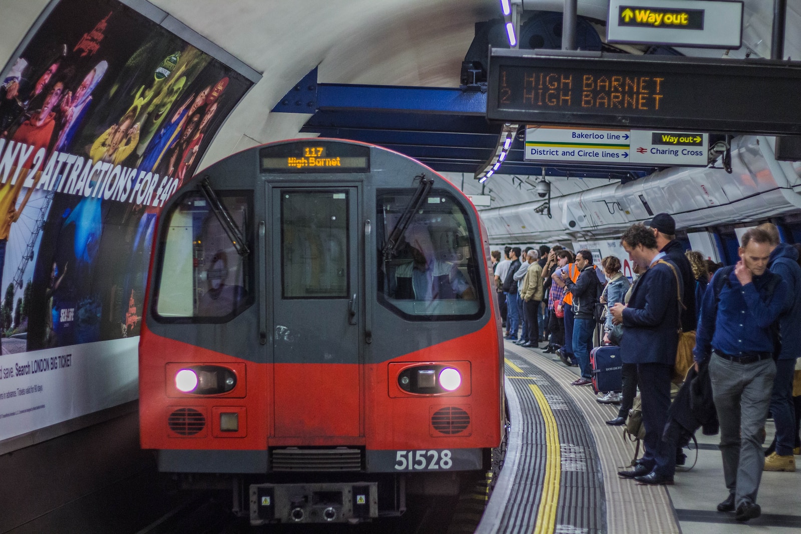 red and black train in the city during daytime