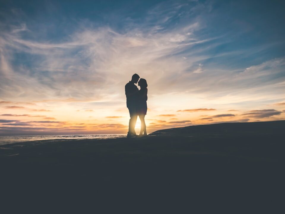 man and woman hugging each other