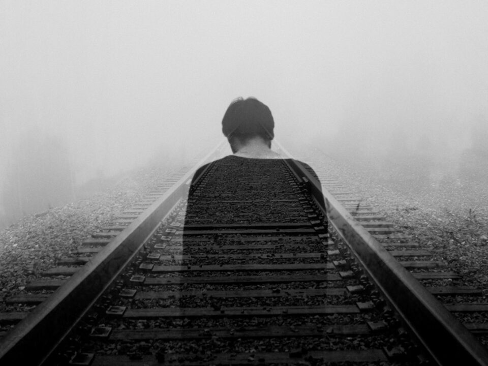 grayscale photo of man wearing black shirt