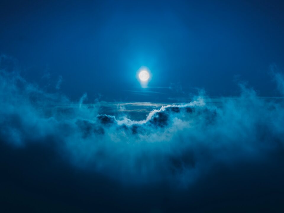 full moon along clouds
