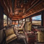 an abandoned train car in the middle of nowhere