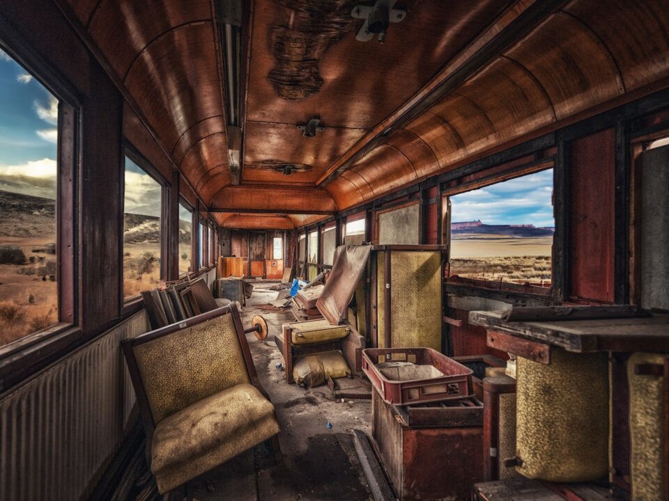 an abandoned train car in the middle of nowhere