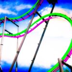 a roller coaster in the middle of a cloudy sky