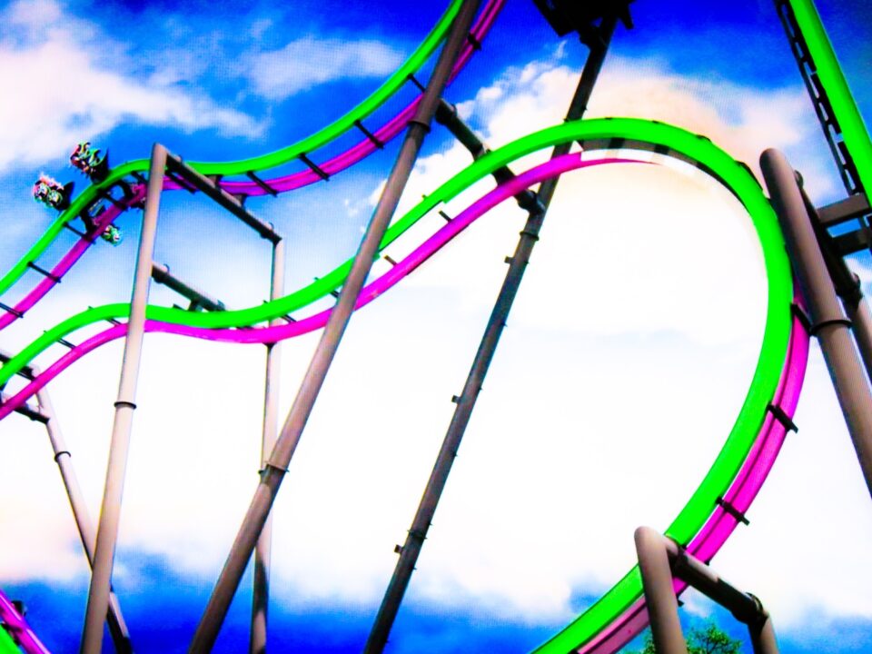 a roller coaster in the middle of a cloudy sky