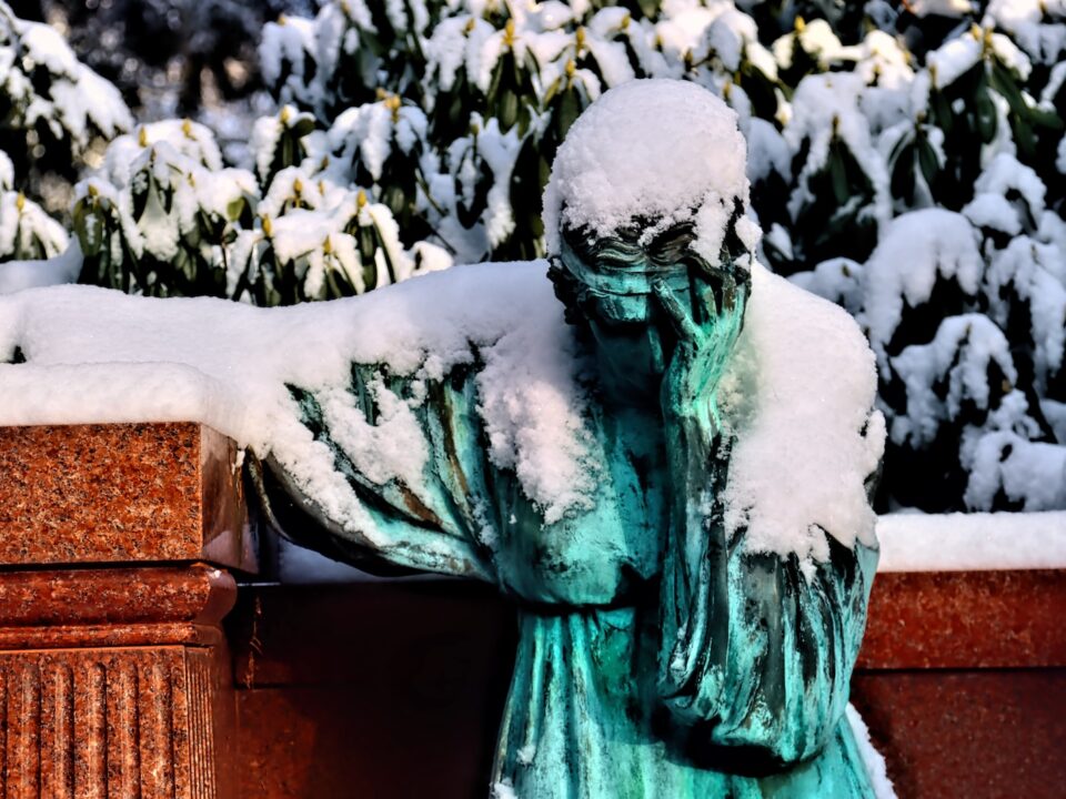 green statue of a man