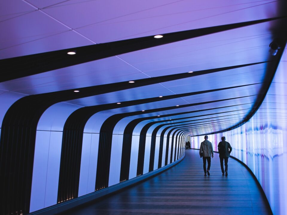 man walking through pathway