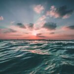 body of water during golden hour