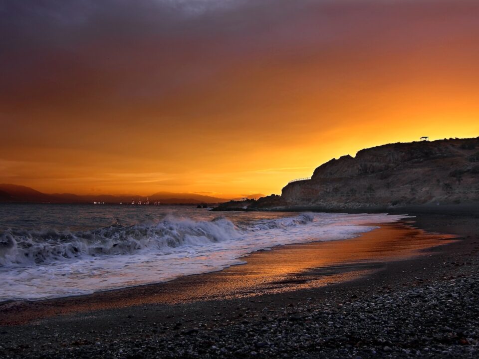 landscape photography of seashore near cliff