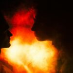 a couple of people standing next to each other