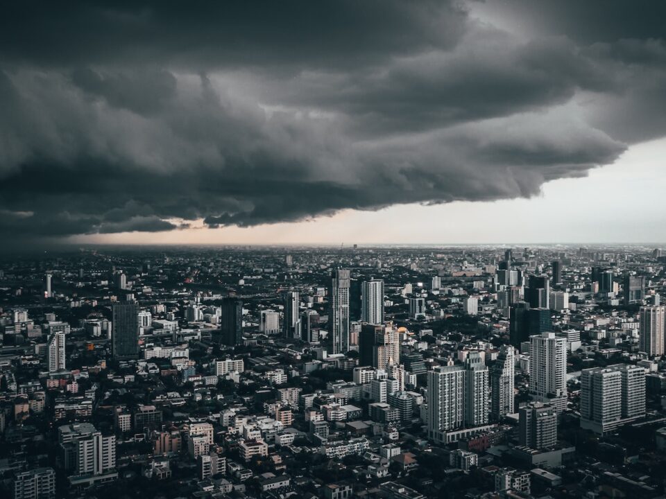 dark cloud above city buildings
