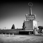 a black and white photo of a motel