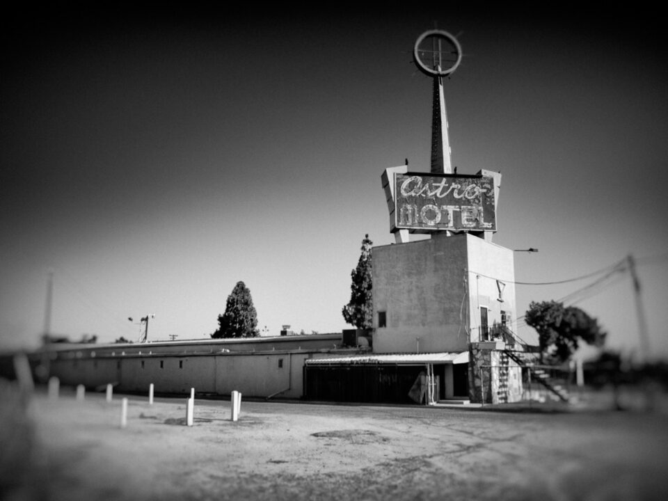 a black and white photo of a motel