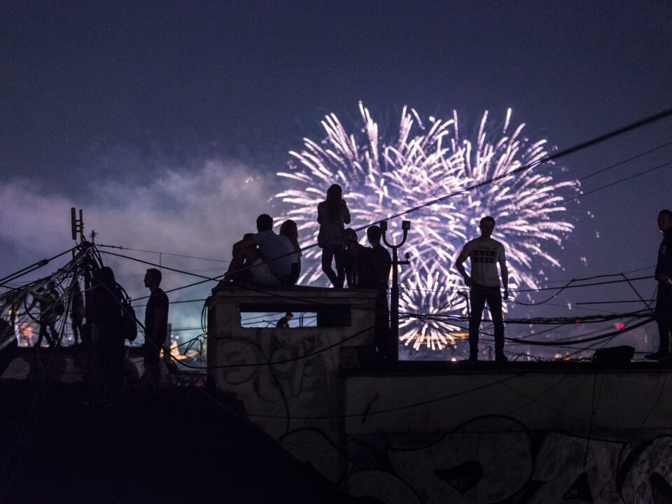 person watching fireworks display