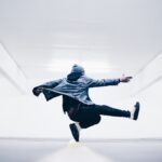 man jumping in the middle taken at daytime