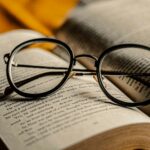 black framed eyeglasses on book page