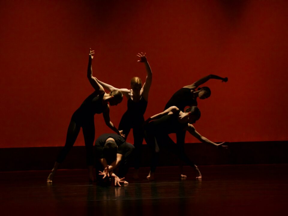 group of people performing on stage