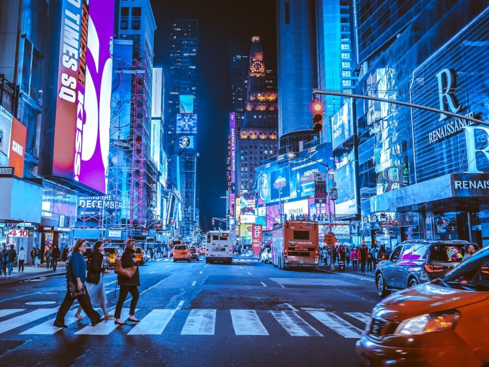 people walking on pedestrian lane during night time