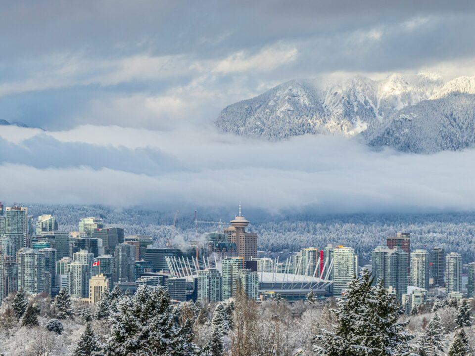a city with snow covered mountains