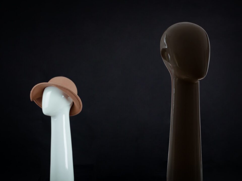 a white and a brown object on a black background
