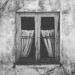 grayscale photo of closed window