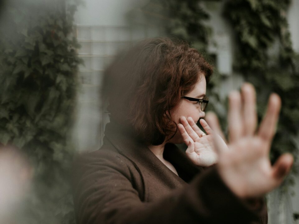 man in brown sweater wearing black framed eyeglasses