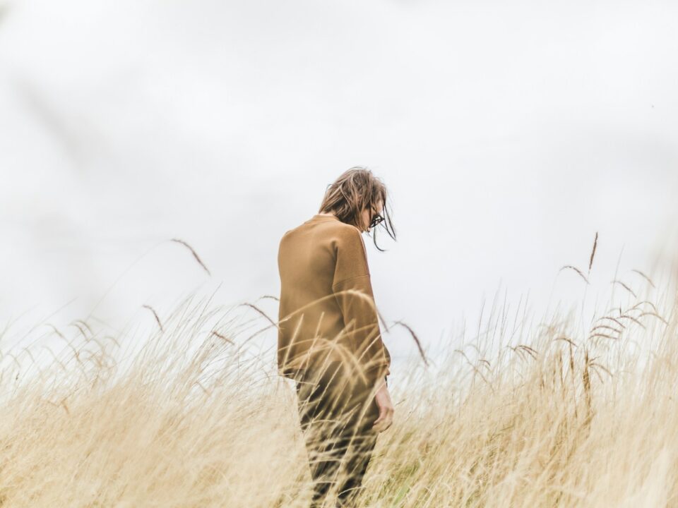 person standing in the middle of wheat field