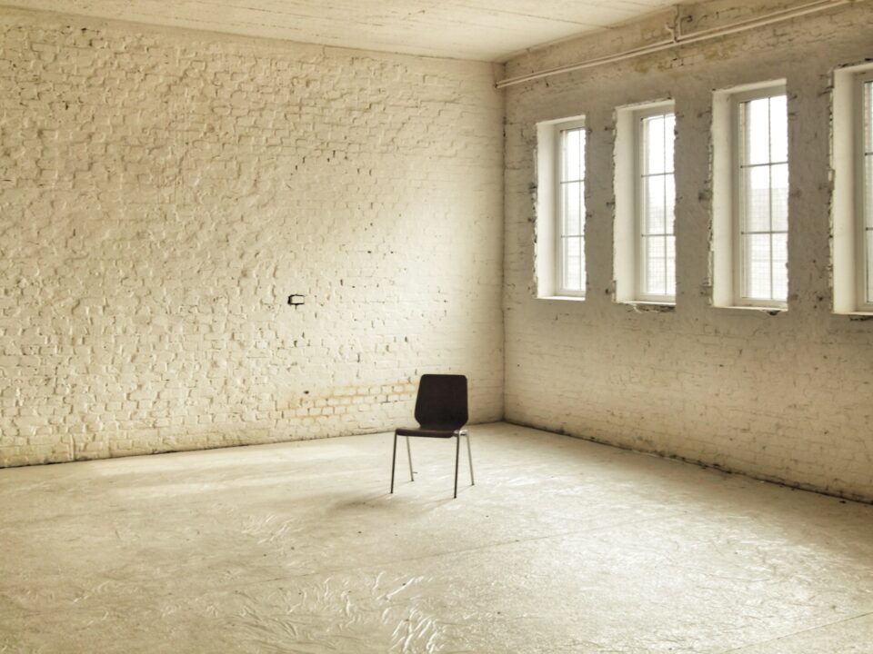 black chair beside brown wall