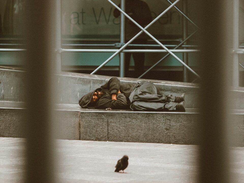 woman lying on floor near window