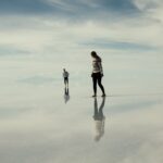 man and woman walking on clouds