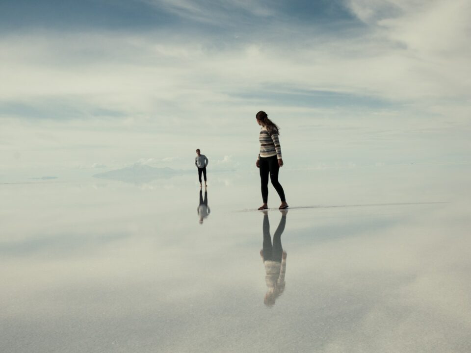 man and woman walking on clouds