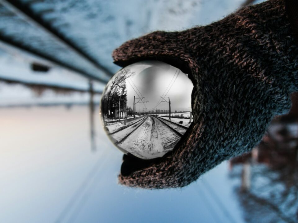 person holding clear ball