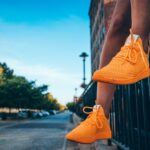 person wearing orange shoes