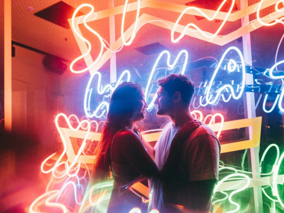 selective focus photography of man and woman about to kiss