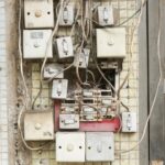 several assorted power switches mounted on white wall