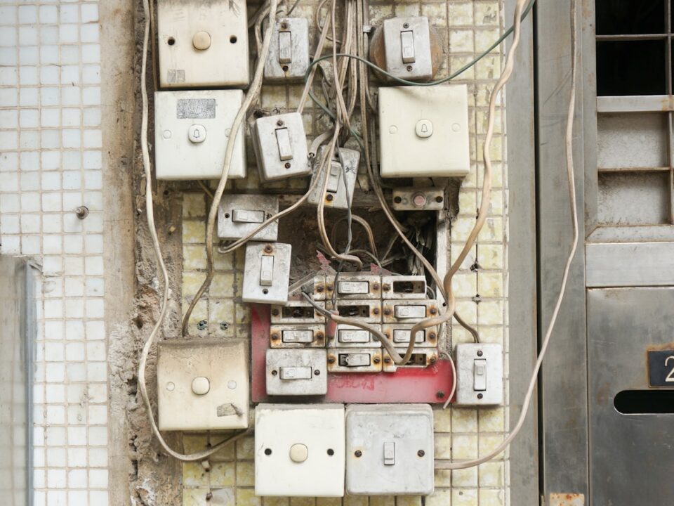 several assorted power switches mounted on white wall