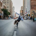 person hand standing on concrete road