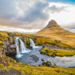 waterfalls and mountains during daytime