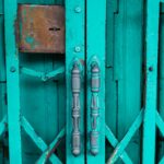a blue door with a metal handle on it