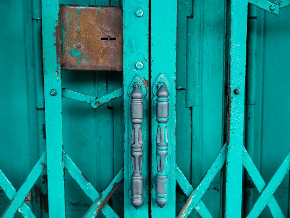 a blue door with a metal handle on it
